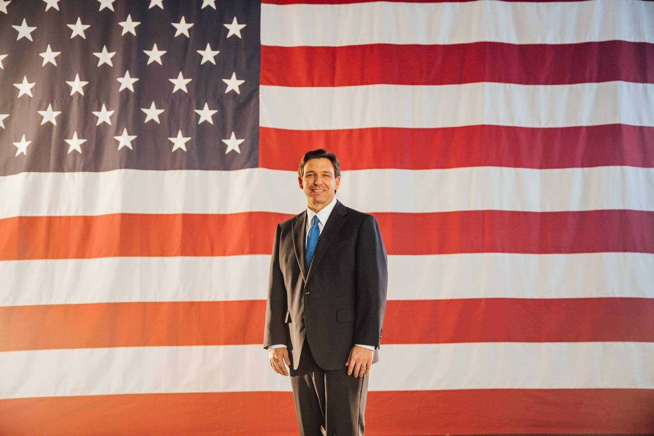 DeSantis Standing In front of American Flag
